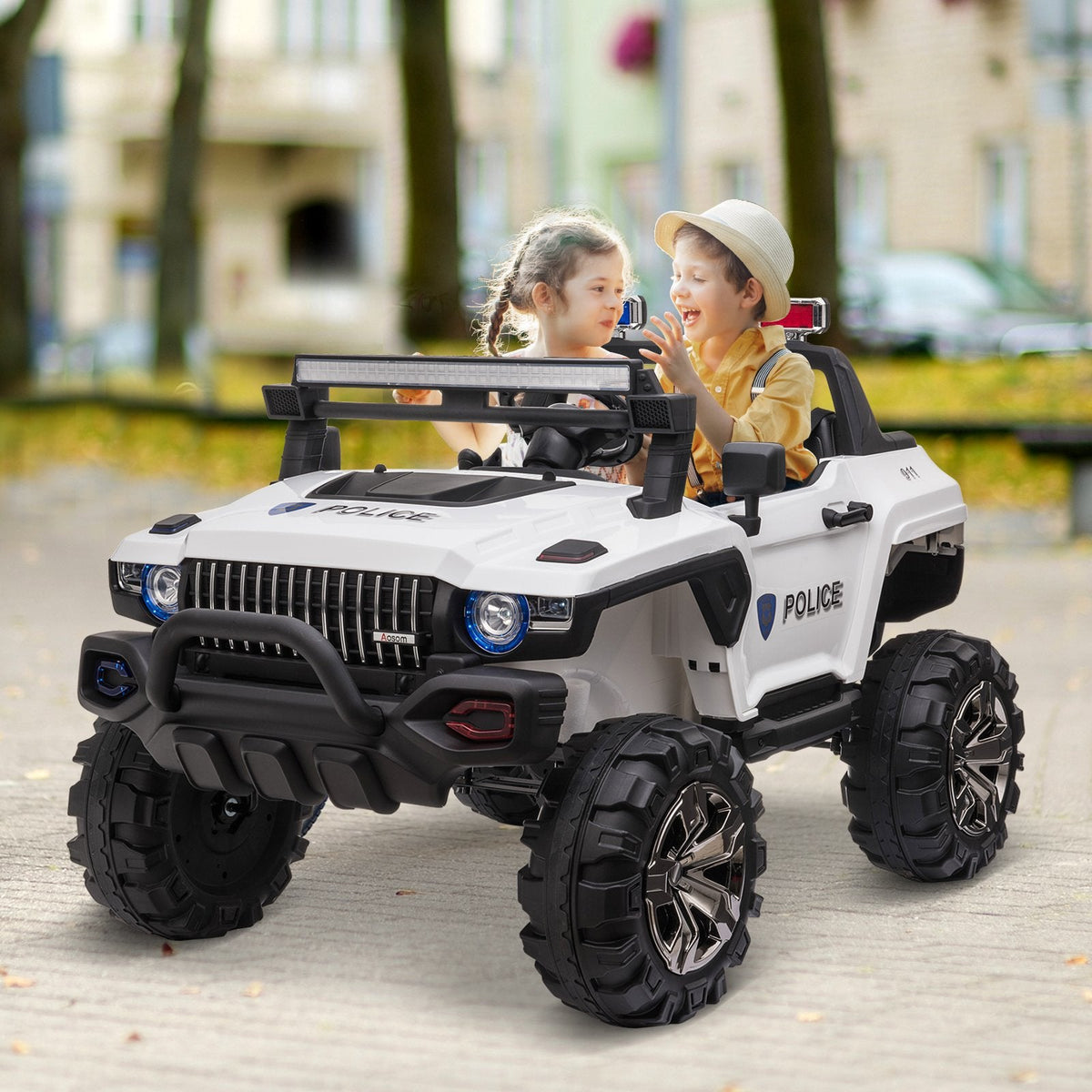 Kids in white ride-on truck
